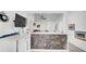 Kitchen featuring stainless steel appliances, quartz countertops, and a breakfast bar at 11336 Bingham Ct, Orlando, FL 32837