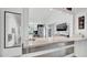 Open concept kitchen with stainless steel appliances and a breakfast bar at 11336 Bingham Ct, Orlando, FL 32837