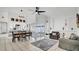 Open-concept living space with tile floors, comfortable seating, and a view of the kitchen at 11336 Bingham Ct, Orlando, FL 32837