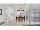 Bright living area with tile floors, modern lighting, and sliding glass doors leading to an enclosed patio at 11336 Bingham Ct, Orlando, FL 32837