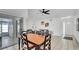 Spacious living room featuring tile flooring, a ceiling fan, comfortable seating, and access to a screened-in patio at 11336 Bingham Ct, Orlando, FL 32837