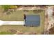 Aerial perspective of a new home on a grassy lot with a driveway, offering privacy and space at 12380 Sw 71St Lane Rd, Ocala, FL 34481