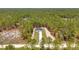 New construction home with a long driveway nestled among the trees at 12380 Sw 71St Lane Rd, Ocala, FL 34481