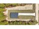 New home featuring a dark roof, a long driveway, and positioned on a lush grassy lot at 12380 Sw 71St Lane Rd, Ocala, FL 34481