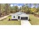 New construction one-story home with tidy lawn and paved driveway at 12380 Sw 71St Lane Rd, Ocala, FL 34481