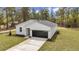 Overhead view of a new construction home with new landscaping and long driveway at 12380 Sw 71St Lane Rd, Ocala, FL 34481