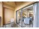 Balcony view into living room featuring modern furnishings and an open floor plan at 12527 Floridays Resort Dr # 401E, Orlando, FL 32821