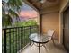 Cozy balcony with seating overlooking lush greenery and a scenic view at sunset at 12527 Floridays Resort Dr # 401E, Orlando, FL 32821