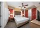 Comfortable bedroom with a king-size bed, ceiling fan, and stylish decor at 12527 Floridays Resort Dr # 401E, Orlando, FL 32821