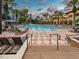 Stunning community pool surrounded by palms and resort-style amenities at 12527 Floridays Resort Dr # 401E, Orlando, FL 32821