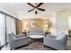 Cozy living room featuring comfortable seating, neutral tones, and ample natural light at 12527 Floridays Resort Dr # 401E, Orlando, FL 32821