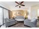Cozy living room with ceiling fan, comfortable seating, and neutral decor at 12527 Floridays Resort Dr # 401E, Orlando, FL 32821