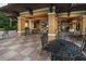 Relaxing outdoor bar area with comfortable seating and a TV at 12527 Floridays Resort Dr # 401E, Orlando, FL 32821
