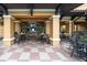Relaxing outdoor patio area with tables and chairs, perfect for dining and socializing at 12527 Floridays Resort Dr # 401E, Orlando, FL 32821
