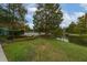 A beautiful pool area with a pond in the background at 12527 Floridays Resort Dr # 401E, Orlando, FL 32821