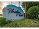FloridaDays Resort sign in Orlando with manicured landscaping, sunny skies, and lush greenery at 12527 Floridays Resort Dr # 401E, Orlando, FL 32821