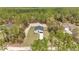 Aerial view of the house showing its placement amidst the green trees in the community at 12639 Sw 78Th Pl, Dunnellon, FL 34432