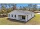 Rear exterior of home featuring covered patio and view of the backyard at 12639 Sw 78Th Pl, Dunnellon, FL 34432