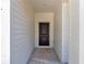Modern front door entrance framed by bright white exterior walls at 13274 Sw 82Nd Ln, Dunnellon, FL 34432