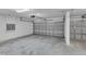 An empty two car garage featuring an automatic garage door opener, and a steel garage door at 1420 Prairie Oaks Dr, St Cloud, FL 34771