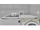 Laundry room showcasing a front load washing machine and a top load washing machine at 1420 Prairie Oaks Dr, St Cloud, FL 34771