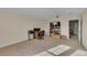 This living room features a desk, chair, tv, and carpeted floors at 1420 Prairie Oaks Dr, St Cloud, FL 34771