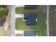 Overhead view of a modern home's roof and property, highlighting its design and landscaping at 17052 Sw 44Th Cir, Ocala, FL 34473