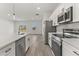 Modern kitchen featuring stainless steel appliances, a center island, and an open layout design at 17052 Sw 44Th Cir, Ocala, FL 34473