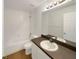 Clean bathroom featuring a shower, vanity and mirror at 1817 Christina Lee Ln, St Cloud, FL 34769