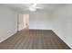 Bedroom with ceiling fan, carpet floors, and view to the hallway at 1817 Christina Lee Ln, St Cloud, FL 34769