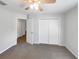 Bedroom featuring carpet floors, a ceiling fan, and a closet at 1817 Christina Lee Ln, St Cloud, FL 34769