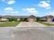 Charming single story home featuring a stone accented facade and a brick paver driveway at 1817 Christina Lee Ln, St Cloud, FL 34769