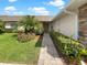 Charming single story home with stone accents, lush landscaping, and a brick pathway at 1817 Christina Lee Ln, St Cloud, FL 34769