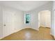 Hallway with tile flooring, window, white doors and access to other rooms at 1817 Christina Lee Ln, St Cloud, FL 34769