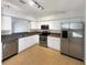 Bright kitchen with stainless steel appliances, tile floor, and white cabinetry at 1817 Christina Lee Ln, St Cloud, FL 34769