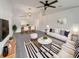 Bright living room boasts a modern design with striped accents and an open floor plan to the dining area at 1817 Christina Lee Ln, St Cloud, FL 34769