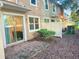 Private backyard featuring a patio, sliding glass doors, and partial privacy fence at 1828 Lemon Drop Ct, Apopka, FL 32712