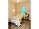 Calm bedroom with a cozy bed, soft lighting, and a 'choose happy' sign at 1828 Lemon Drop Ct, Apopka, FL 32712