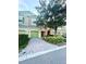 Charming townhouse with a well-manicured front yard and brick-paved driveway at 1828 Lemon Drop Ct, Apopka, FL 32712