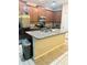 Modern kitchen featuring stainless steel appliances, a center island, and granite countertops at 1828 Lemon Drop Ct, Apopka, FL 32712