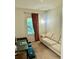 Cozy room with a beige sofa by the window, perfect for a reading nook at 1828 Lemon Drop Ct, Apopka, FL 32712
