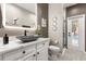 Modern bathroom features a vessel sink, decorative mirrors, and a walk-in shower at 19313 Pummelo Dr, Orlando, FL 32827