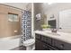 Traditional bathroom features a shower over tub and single vanity at 19313 Pummelo Dr, Orlando, FL 32827