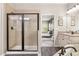 Elegant bathroom featuring a glass shower and access to the main bedroom at 19313 Pummelo Dr, Orlando, FL 32827