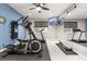 Home gym with modern equipment, mounted TV screens, and motivational mirror at 19313 Pummelo Dr, Orlando, FL 32827