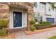 Charming home entrance with a blue front door, stone accents, and meticulously landscaped walkway at 19313 Pummelo Dr, Orlando, FL 32827