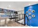 Upstairs game room with a pool table and blue accent wall at 19313 Pummelo Dr, Orlando, FL 32827