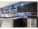 Features a popcorn maker, sink, dark cabinets, stainless steel appliances, and superhero decor at 19313 Pummelo Dr, Orlando, FL 32827