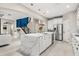Spacious kitchen with a large island, stainless steel appliances, and white cabinets at 19313 Pummelo Dr, Orlando, FL 32827