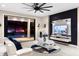 Modern living room with wall-mounted TV, stylish decor, and access to the outdoor pool at 19313 Pummelo Dr, Orlando, FL 32827